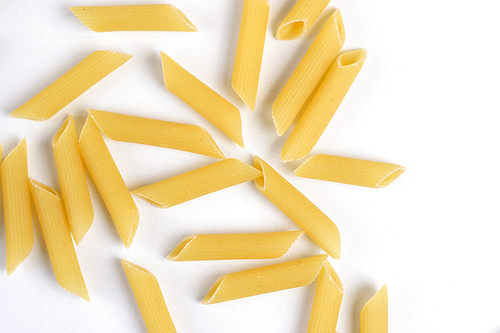 Penne pasta on white background