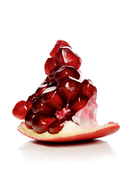 Studio shot of pomegranate fruit