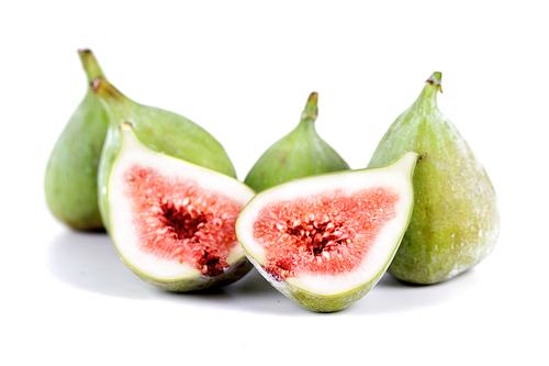 Close-up of figs on white background