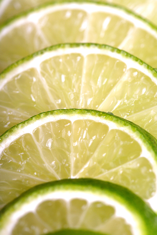 Lime slices on white background