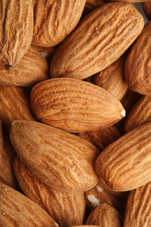 Almonds on white background - close-up