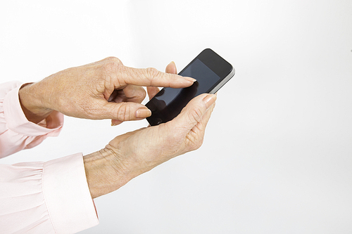 Cropped image of senior businesswoman using smart phone in office
