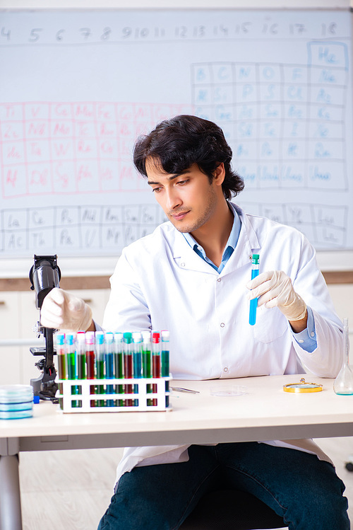 Young chemist working in the lab