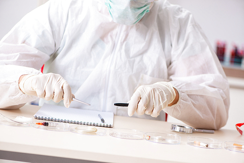 Young expert criminologist working in the lab