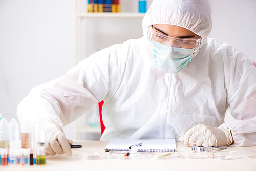 Young expert criminologist working in the lab