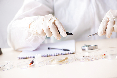 Young expert criminologist working in the lab