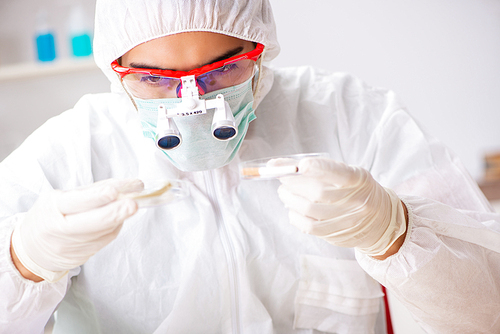 Young expert criminologist working in the lab