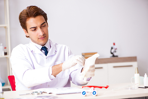 Young expert criminologist working in the lab