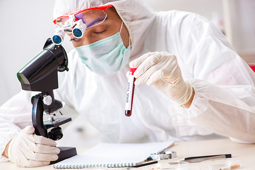 Young expert criminologist working in the lab