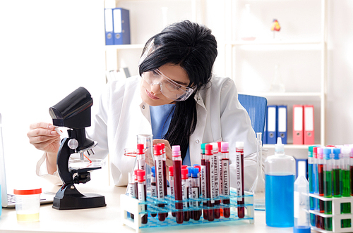 Female chemist working at the lab