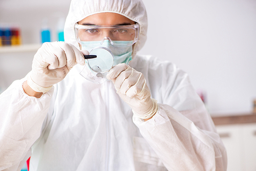 Young expert criminologist working in the lab