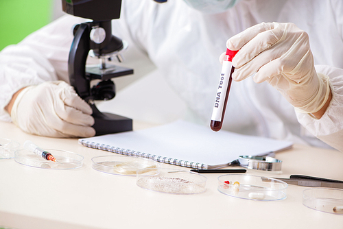 Young expert criminologist working in the lab