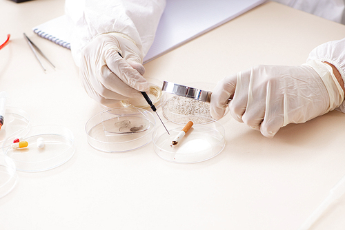 Young expert criminologist working in the lab