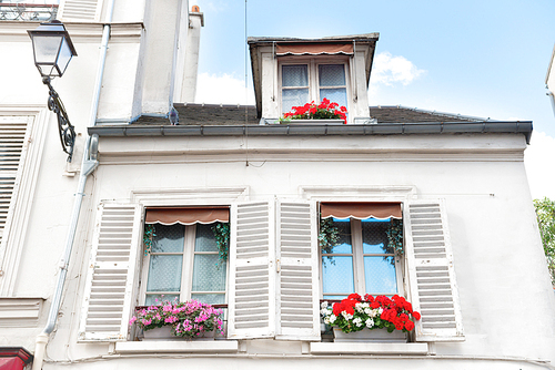 Paris windows with flowers on Montmartre street