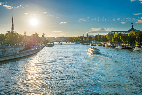 Beautiful sunset with Eiffel Tower and Seine river in Paris, France