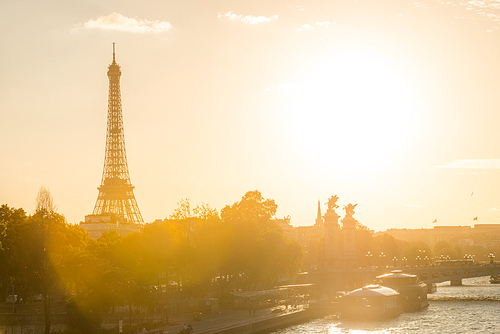 Beautiful sunset with Eiffel Tower and Seine river in Paris, France