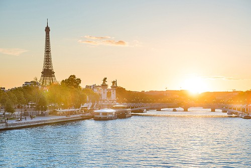 Beautiful sunset with Eiffel Tower and Seine river in Paris, France