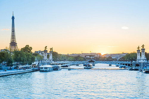 Beautiful sunset with Eiffel Tower and Seine river in Paris, France