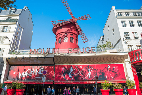 PARIS, FRANCE - SEPTEMBER 24, 2018: Moulin Rouge. Moulin Rouge is landmark cabaret built in 1889, locating in Paris Pigalle  red light district in Paris, France on September 24, 2018