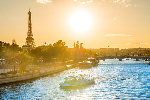 Beautiful sunset with Eiffel Tower and Seine river in Paris, France