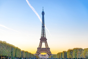 Eiffel Tower on Park Champ de Mars at sunset in Paris, France