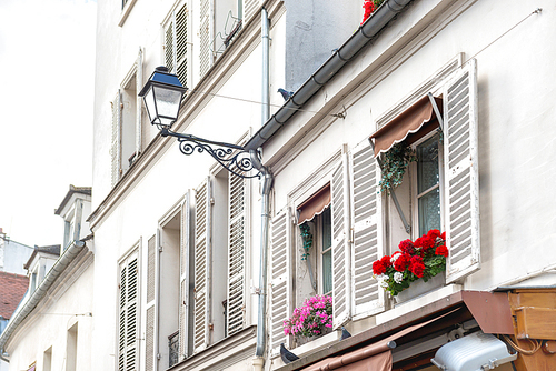 Paris windows with flowers on Montmartre street