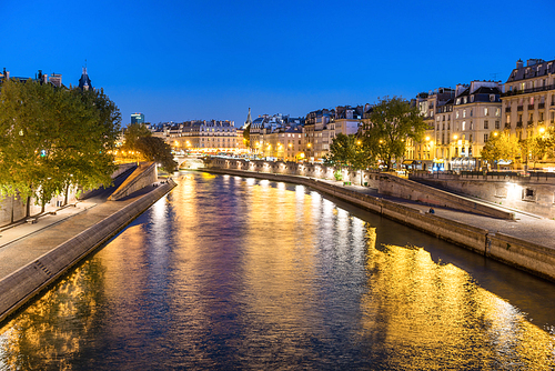 paris at night -  over seine river and street with lights