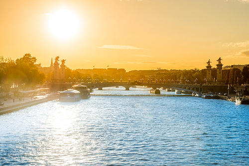 Beautiful sunset with Eiffel Tower and Seine river in Paris, France