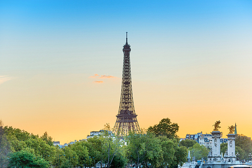 Eiffel Tower on Park Champ de Mars at sunset in Paris, France