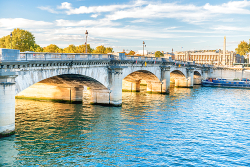 Old stone bridge across Seine river in Paris