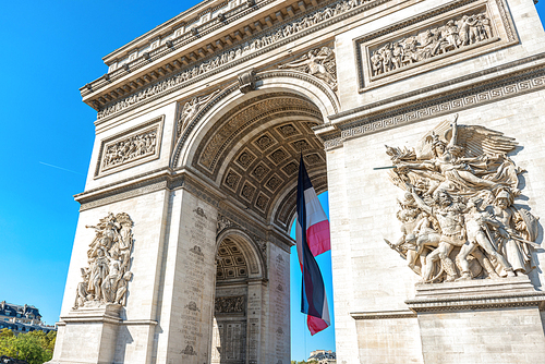 Arc de Triomphe on blue sky in Paris France