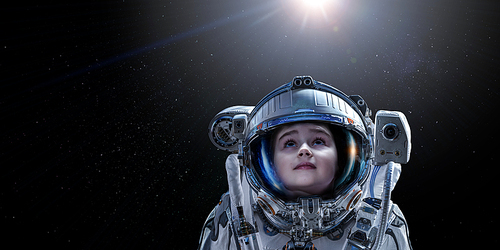 Kid girl astronaut in space over Earth planet. Elements of this image furnished by NASA