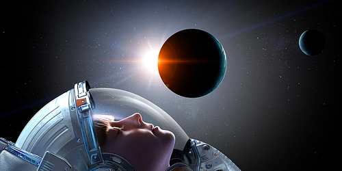 Kid girl astronaut in space touching planet. Elements of this image furnished by NASA