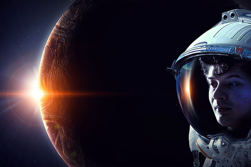 Astronaut in space over Earth planet. Elements of this image furnished by NASA