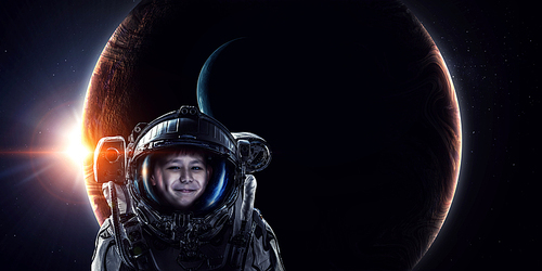 Kid boy astronaut in space over Earth planet. Elements of this image furnished by NASA