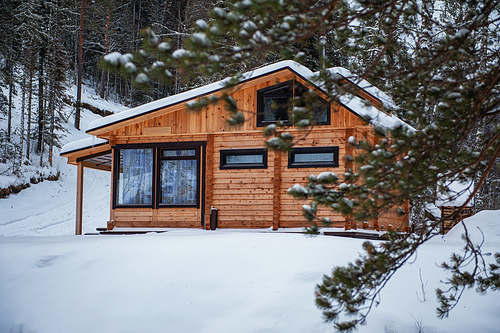 Winter holiday house in forest. Clean air, rest and relaxation. Unity with nature.