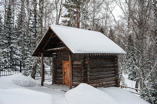 Antique wooden distillery house. Retro building of the early 19th century.