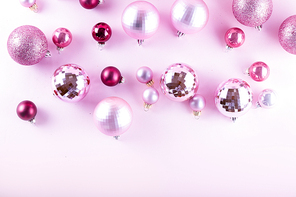 Christmas decorations on pink background, top view