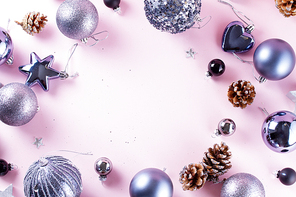 Gray Christmas decorations frame on pink background