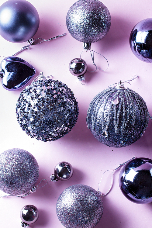 Gray Christmas festive decorations on pink background