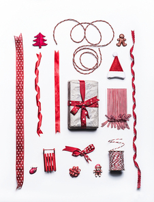 Christmas gift and present wrapping and packaging ribbons and decoration on white background, top view, flat lay