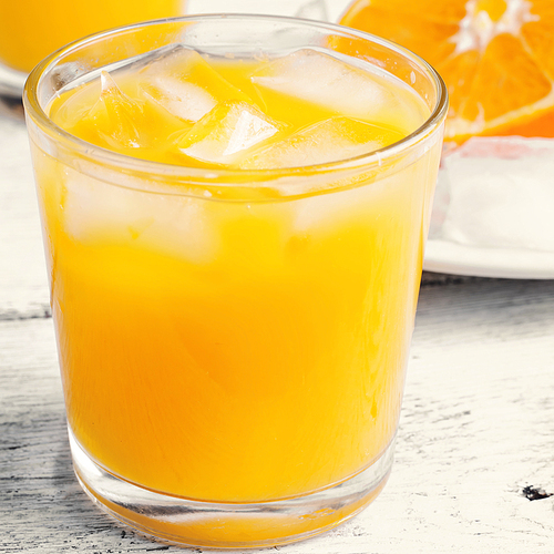 Glass cup with fresh orange juice vitamin.Photo tinted
