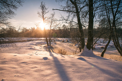 Winter sunrise in Belarus. Cold winter morning. Winter river.