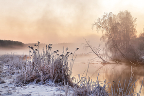 Winter misty morning on the river. Rural foggy and frosty scene in Belarus