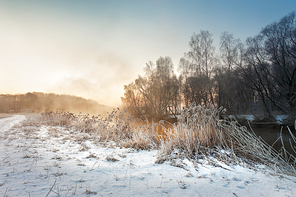 Winter misty morning on the river. Rural foggy and frosty scene in Belarus