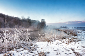 Winter misty morning on the river. Rural foggy and frosty scene in Belarus