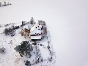 Aerial view of authentic country house in winter. Dududki village in Belarus near Minsk