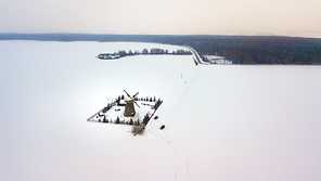 Authentic wooden windmill at winter season. Aerial view of landmark Dudutki in Belarus
