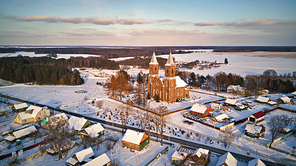 Aerial view of old Christian church. Rural winter scene. Village Rubezhevichi near Minsk, Belarus