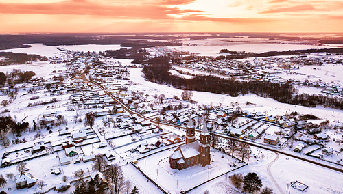 Rural winter scene. Aerial view of old Christian church. Village Rubezhevichi near Minsk, Belarus